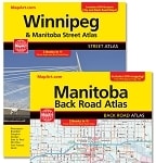 Manitoba and Winnipeg Back Road Atlas showing coil-bound pages, downtown Winnipeg map, and provincial highway routes.