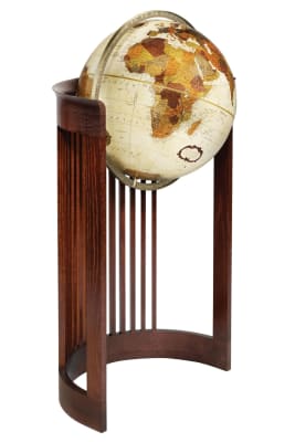 Elevate your decor with the Frank Lloyd Wright Barrel World Globe. This elegant 16-inch floor globe features a stand directly inspired by Wright's renowned Barrel Chair, an iconic design from the Frank Lloyd Wright Foundation archives. The stand's history
