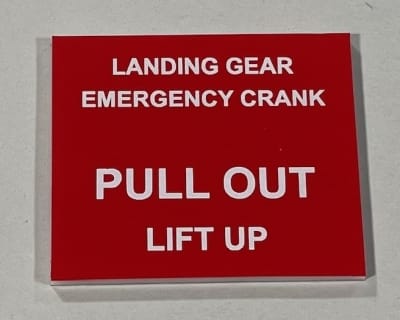 Landing Gear Emergency Crank Cover Placard