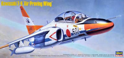 Photo of Hasegawa model kit of Japanese T-4 fighter flying against clouds.