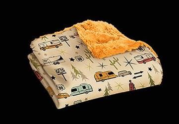 The Camp Casual Road Trip Throw Blanket (Model CCâ€‘005RT) is a superâ€‘soft, machineâ€‘washable polyester blanket measuring 50" Ã— 60". It features a retro road trip print on the front with velvety pumpkinâ€‘colored fabric on the back.
