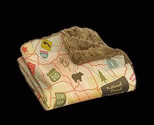 The Camp Casual Travel Map Throw Blanket (Model CCâ€‘005TM) is a cozy, machineâ€‘washable polyester blanket featuring a vintageâ€‘style travel map design. It measures 50" Ã— 60" and comes with a reusable plastic carrier, making it perfect for RVs.