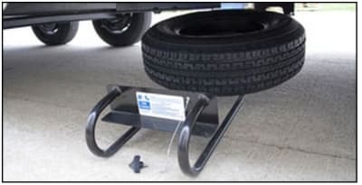 The BAL 28217B Hide-A-Spare Tire Carrier is a recessed, under-chassis mount system designed for travel trailers with I-beam frames. It provides a secure, out-of-the-way storage solution for your spare tire, freeing up space on the rear bumper.