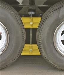 The Camco Plastic Trailer Wheel Stop Chock (44622) is a device used to stabilize tandem axle trailers, such as RVs and trailers. Placed between the tandem tires, it prevents forward and backward movement while parked or rehitching.