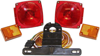 The Peterson Manufacturing V540 Trailer Light Kit is a complete incandescent lighting and reflector set for trailers under 80 inches wide. The kit is DOT compliant and includes the necessary wiring harness, license plate bracket, and mounting hardware.