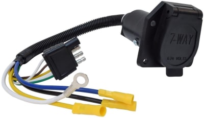 The A10-7084 is a trailer wiring adapter manufactured by Valterra Products (under the "Mighty Cord" brand) that converts a vehicle's 7-way round blade connector to a trailer's 4-way flat connector. It features a 12-inch pre-wired harness.