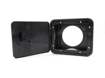 The Thetford 94303 Storage Sewer Hose Hatch with Thumb Latch - Black, also sold under the B&B Molders brand as part number 94303. It is designed to accept a 4-inch rigid PVC or flexible hose to create an external storage area for your RV sewer hose.