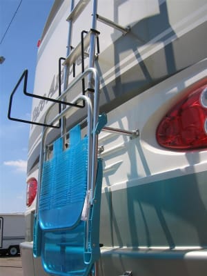The Madison Accessories 22105 Camping Chair Rack, a heavy-duty, ladder-mounted storage solution for RVs. It securely holds folding chairs while traveling or camping, freeing up interior storage space.