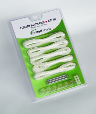 The United Shade 650004 Pleated Shade Repair Kit in beige, also known as the "Pleated Shade First Aid Kit". This kit is designed to repair broken cords in pleated window shades, particularly those found in RVs.