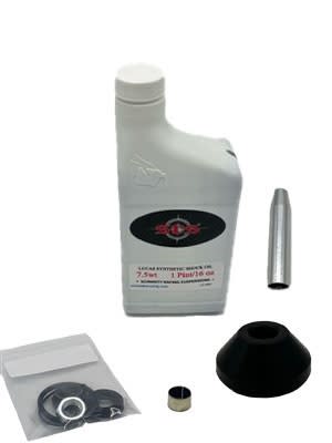 All of the components includes in the rear shock rebuild bundle for the Honda ATC 350X, including a bottle of Lucas synthetic shock oil