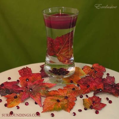 Giselle vase with 3" floating candle, decorative leaves and burgundy diamonds