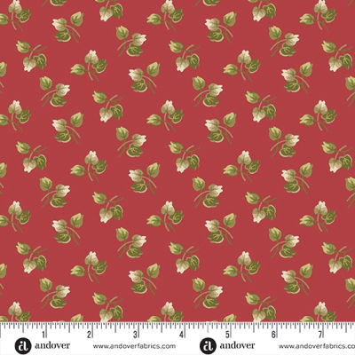 JOY Holly Leaves in Cranberry by Laundry Basket Quilts shows a peachy red favric with leaves.