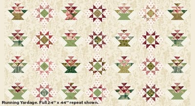 JOY Panel in Red & Green on Cream by Laundry Basket Quilts shows a quilt panel of pre-printed quilt blocks on a cream ground.