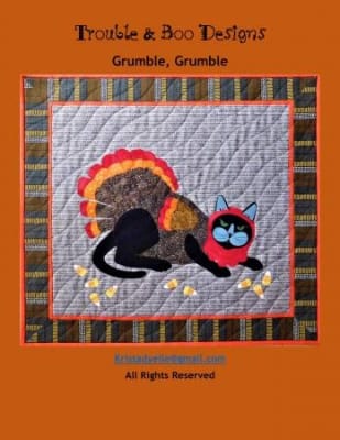 Grumble Grumble Cat Quilt Pattern shows a black cat in a turkey costume.
