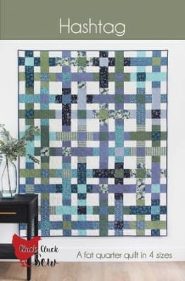 HASHTAG Quilt Pattern by Cluck Cluck Sew shows a straight set quilt with colorful blocks  of small squares in bright colors on a white background.