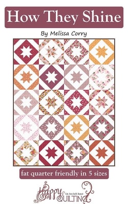 How They Shine Quilt Pattern by Melissa Corry shows a pretty star quilt  with  pieced blocks in a in shades of pink and red and white.