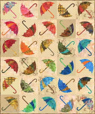 Dancing Umbrellas Batik Quilt Pattern with stencil shows an array of brightly colored umbrellas facing different directions, in colorful batik fabrics.