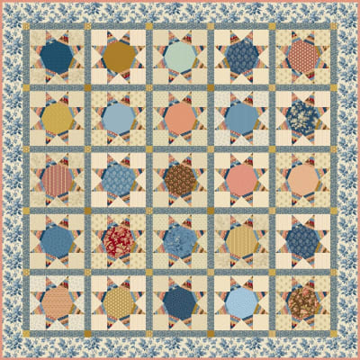 Twinkle Star Quilt Pattern by Laundry Basket Quilts  shows a traditional  star quilt in shades of many colors.