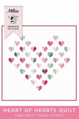 Heart of Hearts Quilts Pattern by Melissa Mortenson shows a pretty, delicate heart quilt where the large heart is created by smaller heart blocks in shades of soft pink and green on a white ground.