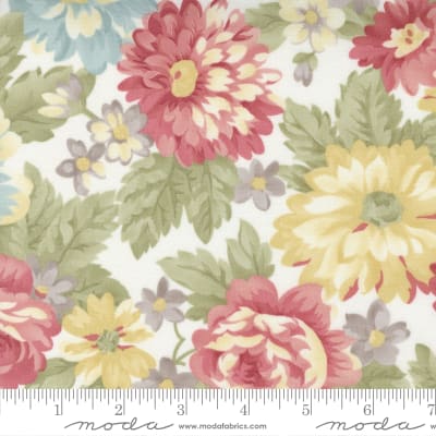 Lush packed medium scale floral in blues and yellows with rose accents