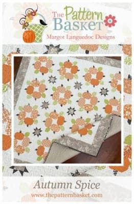 This quilt depicts rows of blooming flower pots with a charming floral border print, from The Pattern Basket