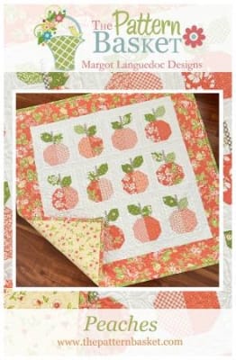 Peaches Quilt Pattern by The Pattern Basket shows a small quilt with peaches and a pretty floral border.