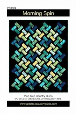 Morning Spin Quilt Pattern by Pine Tree Country Quilts shows bright, colorful rectangles on point set against a dark black background in a snazzy layout and design.