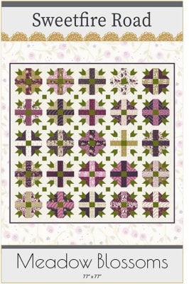 This quilt pattern shows a traditional pieced block with a center cross in a multicolor design, with five blocks across x five blocks down.