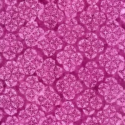 B3220-BERRY from the Tonga Batik Sunset Collection shows a geometric  pattern of circles and diamonds in shades of fuschia.