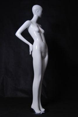 Glossy White Female Mannequin with Abstract Head from www.zingdisplay.com