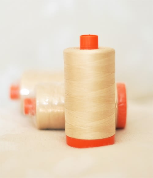 Cream spool of thread