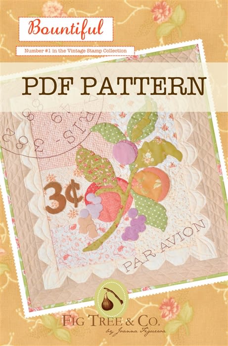 A small vintage wall hanging with charming applique fruits