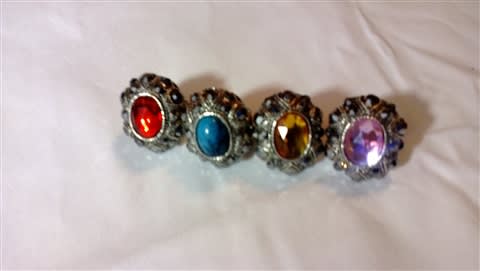 Oval rhinestone metal rings with, stretch bands in pink, amber, blue or red