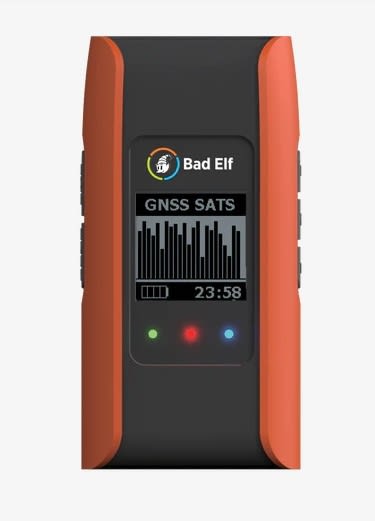 Bad Elf Flex Mini compact GNSS receiver showing Bluetooth and USB connectivity icons, designed for high-accuracy geospatial surveying and RTK capability.