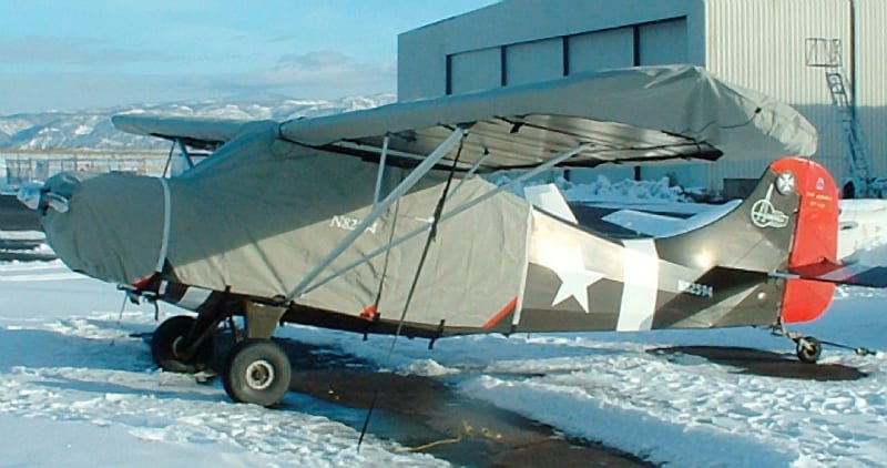 Aeronca Sedan with insulated engine and propeller covers and protective wing and tail covers for winter storage.