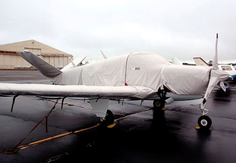 Beech Bonanza aircraft fully outfitted with custom Sunbrella covers, with full protection against sun, snow, and hail.