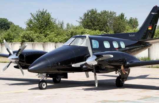 Beech Duke B60 aircraft with a Sunbrella canopy and cockpit cover installed over windshield and side windows.