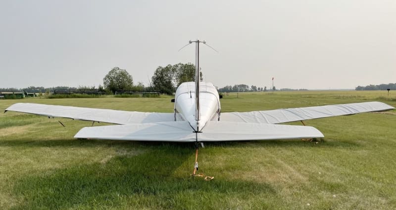 Piper PA-24 Comanche with custom Silver Acrylic Sunbrella canopy, engine, wing, and tail covers, plus propeller and pitot tube protection.