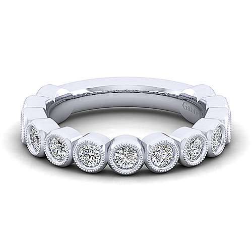 Smooth diamond bezels encompass round brilliant diamonds in this 14k white gold diamond ring.