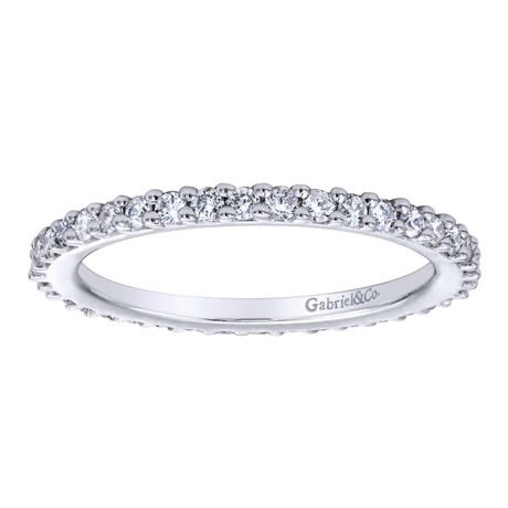 This 14k white gold diamond eternity band uses over one half carats of round brilliant diamonds to wrap around 14k white gold in this never-ending diamond band! This 14k white gold diamond eternity band uses over one half carats of round brilliant diamonds to wrap around 14k white gold in this never-ending diamond band!