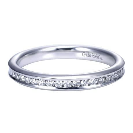 Beautiful round diamonds are set into a 14k white gold channel in this fresh and classic white gold diamond wedding band! Beautiful round diamonds are set into a 14k white gold channel in this fresh and classic white gold diamond wedding band!
