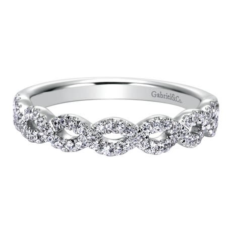 This 14k white gold diamond wedding band features white gold bands that loop around one another for a beautiful effect! This 14k white gold diamond wedding band features white gold bands that loop around one another for a beautiful effect!