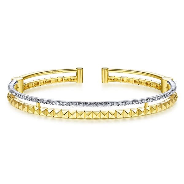 This 14k two tone cuff bangle features one half carats of diamonds.
