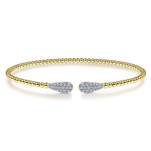 14k yellow gold cable cuff bracelet features two diamond sections.
