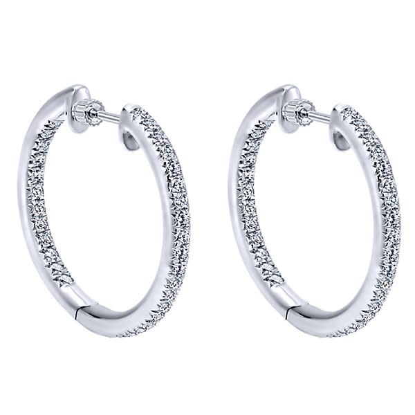 14k white gold mixes with round brilliant diamonds to create this contemporary take on the classic diamond hoop earring!