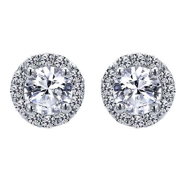 This 14k white gold diamond stud earring features nearly one quarter carat of diamonds in a halo with a round diamonds in center.