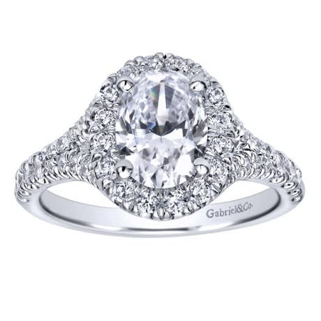 This studded oval diamond halo engagement ring with shimmering round brilliant diamonds is a definite show stopping engagement ring for your lady! This studded oval diamond halo engagement ring with shimmering round brilliant diamonds is a definite show stopping engagement ring for your lady!