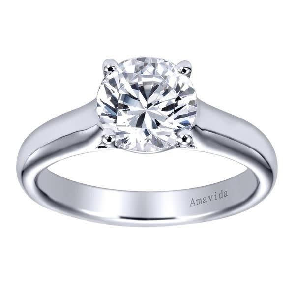 A strong and durable relationship needs a strong and durable engagement ring, this contemporary solitaire engagement ring will do the job and more, perfectly holding a round center diamond!