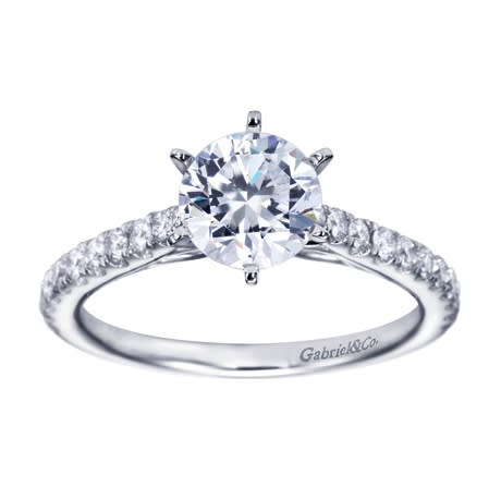 Straight white gold bands and round diamonds firm up this white gold contemporary straight engagement ring.