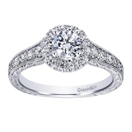 This beautifully done diamond engagement ring comes with sleek metal work and a round center diamond included! She'll scrream with delight when she sees this modern diamond halo engagement ring! This beautifully done diamond engagement ring comes with sleek metal work and a round center diamond included! She'll scrream with delight when she sees this modern diamond halo engagement ring!